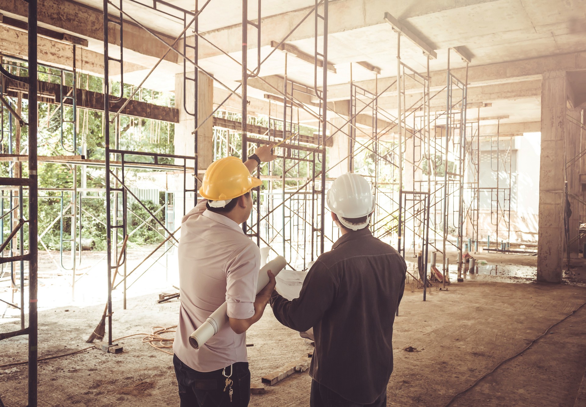 two business man construction site engineer, effect Vintage sun flare